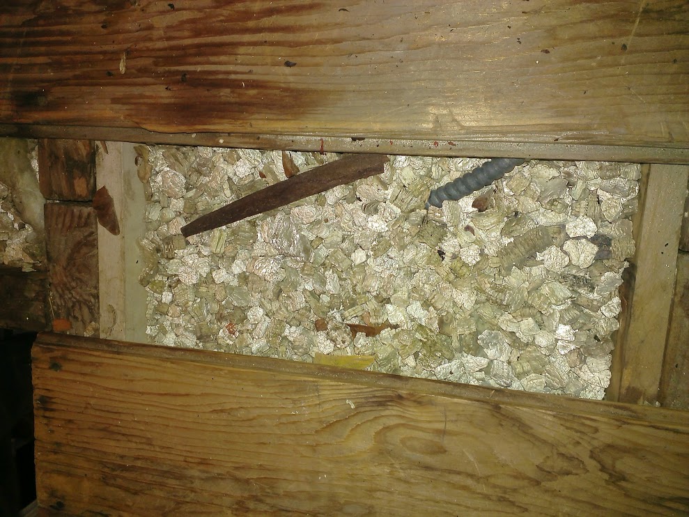 What should you do if your attic contains Zonolite vermiculite?